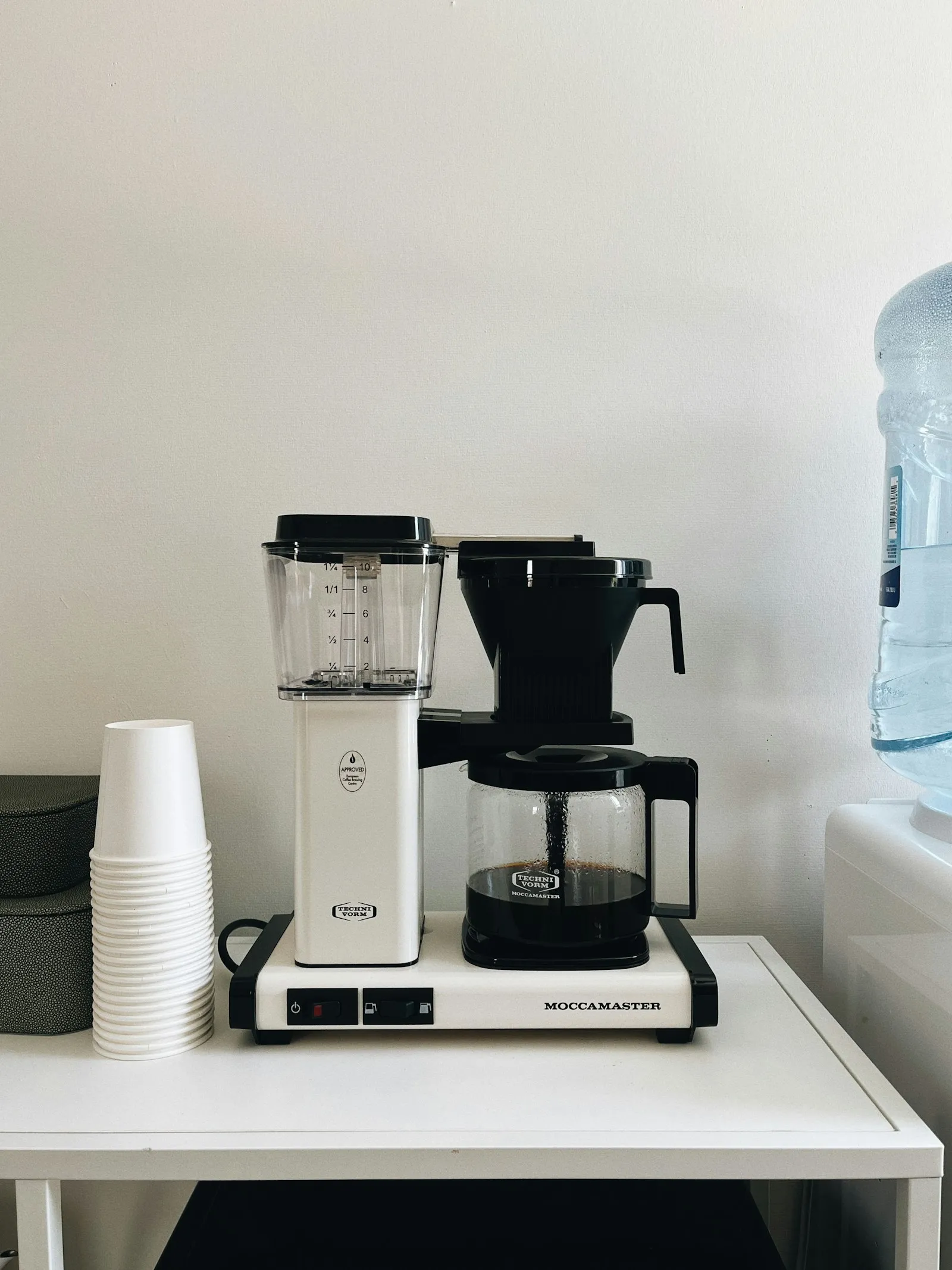 A coffee maker on an office counter
