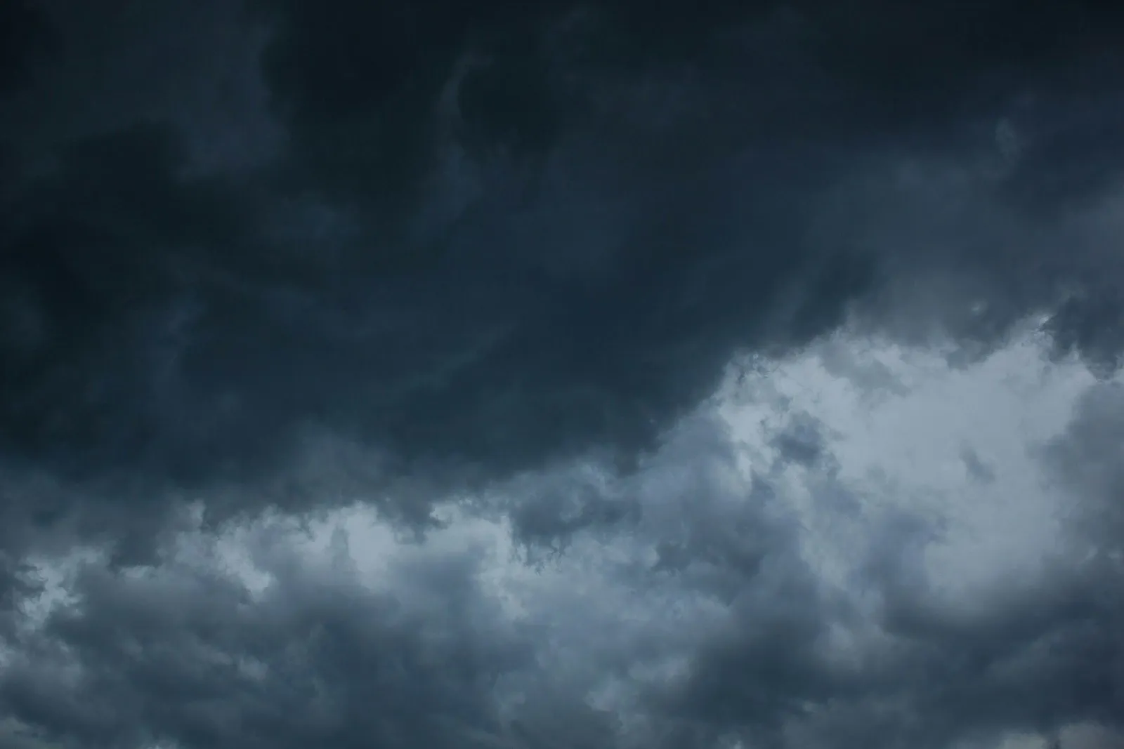 Dark clouds gathering across an open sky