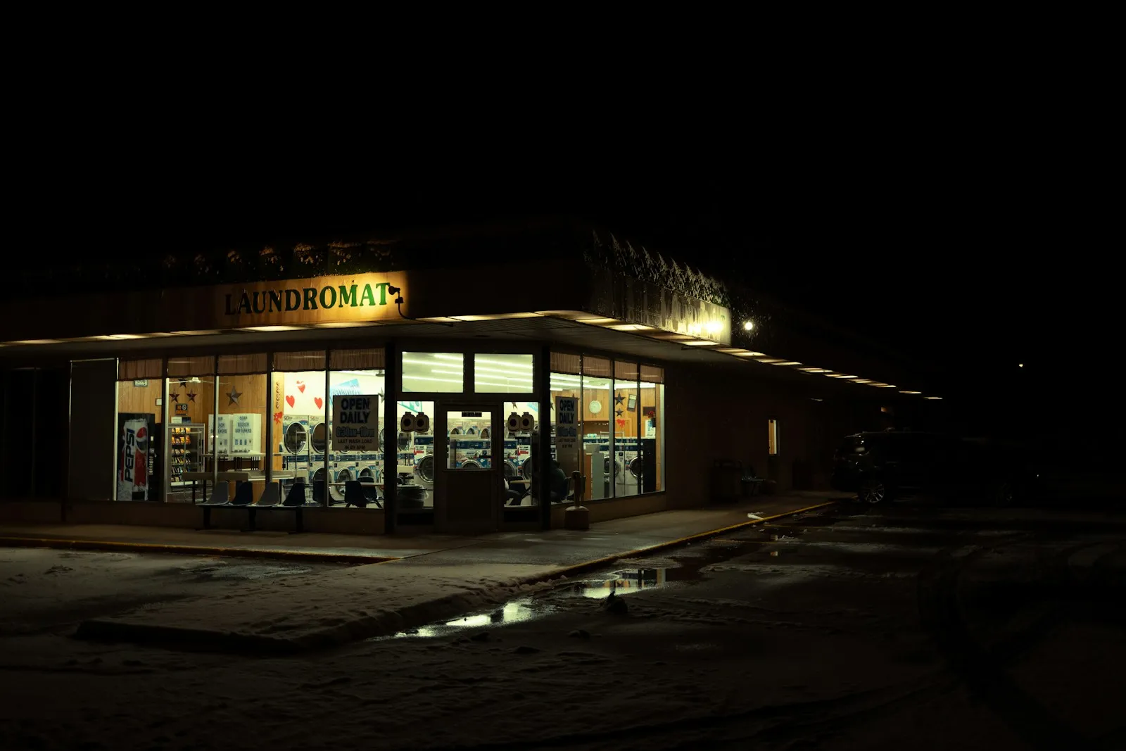 A quiet storefront glowing at night