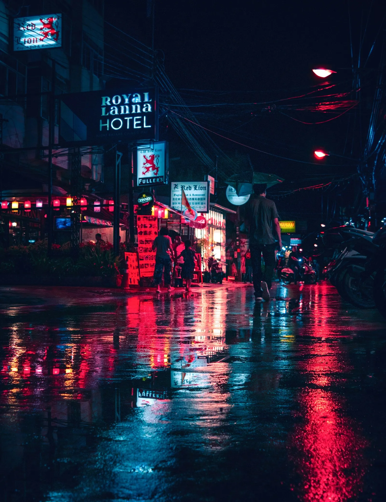 A quiet road and station lights at night